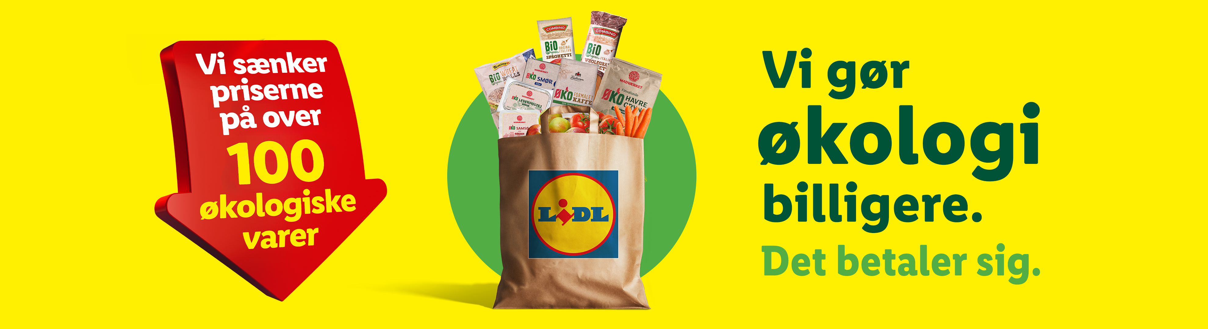 Lidl reklamerer for over 100 økologiske varer til lavere priser, med en pose fyldt med økologiske produkter som pasta, brød og grøntsager.